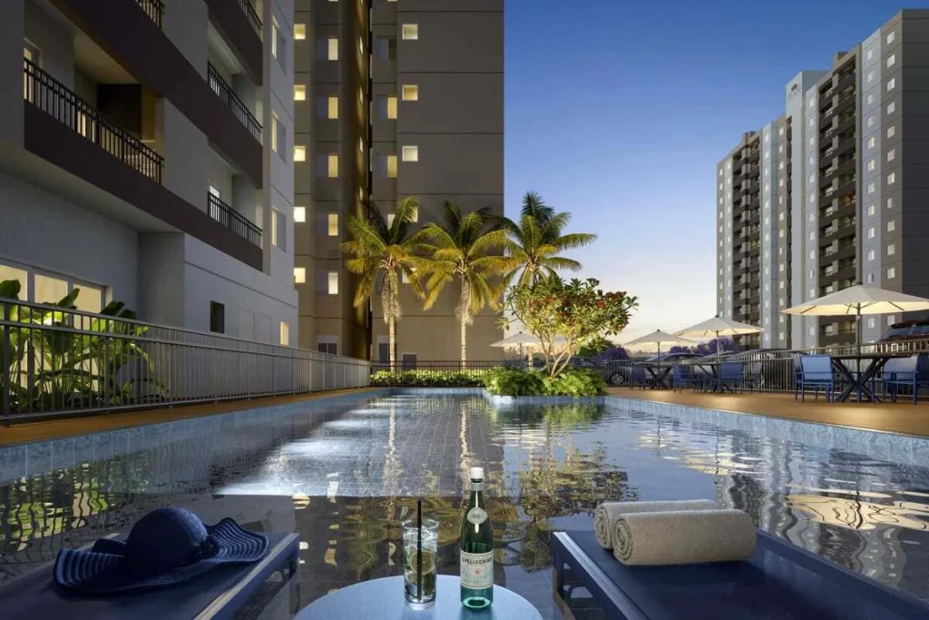 Piscinas adulto e infantil do Eco Vila Tulipa em Hortolândia – torres do condomínio ao fundo